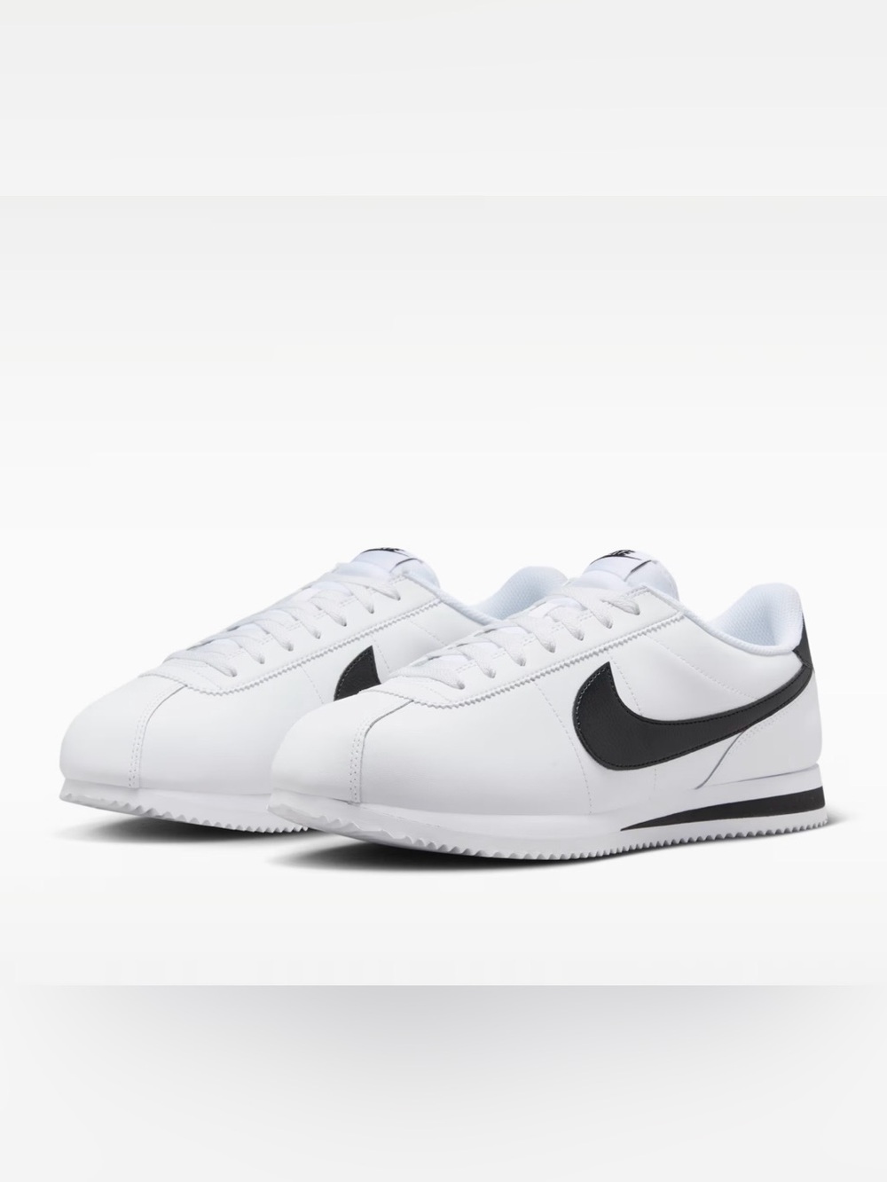 Nike White Leather Sneakers with Black Swoosh